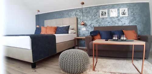 a bedroom with a bed and a table at Villa Ana Apartments in Molunat