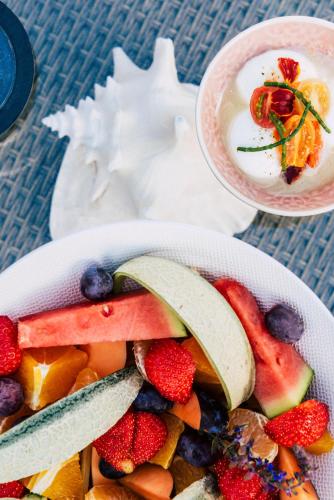 a bowl filled with fruit and a bowl of yogurt at Villa Cecha B&b &Wellness in Ostend
