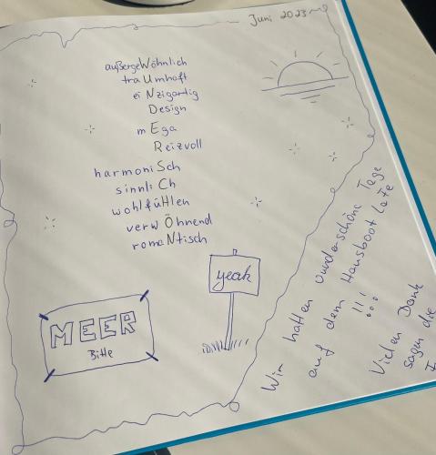 a white sheet of paper with writing on it at Hausboot-LaFe Flensburger Förde in Egernsund