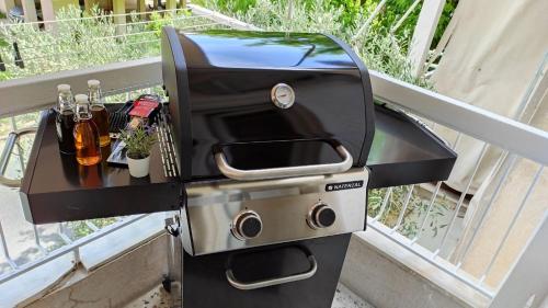 a grill sitting on top of a balcony at Sea Esta 2 bedroom by the beach in Perea