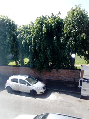 a white car parked in a parking lot at DERBY in Derby