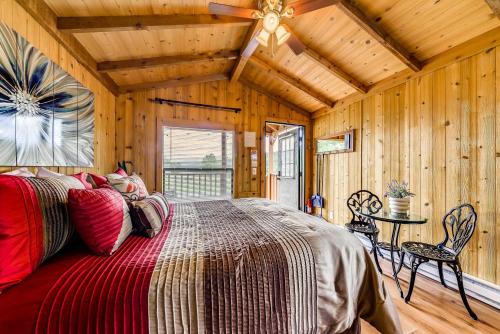 a bedroom with a bed and a ceiling fan at Tiny Home with Covered Porch in Cloudcroft Area! in Mayhill