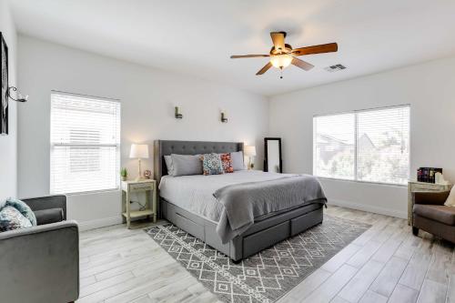 a bedroom with a bed and a ceiling fan at Goodyear Home with Heated Pool, Near Spring Training in Goodyear