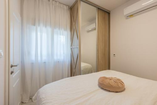 Posteľ alebo postele v izbe v ubytovaní Apartments Milla