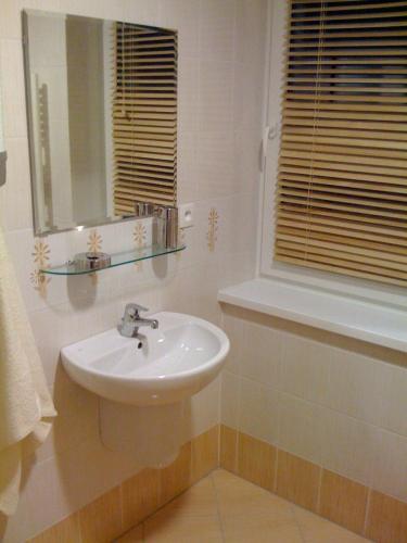 a bathroom with a sink and a mirror at Nová Ponorka Martinské Hole Martinky in Demanovska Dolina