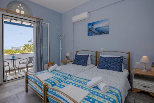 Postel nebo postele na pokoji v ubytování Irini Studios in Tinos