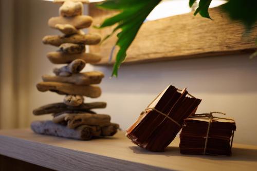 a stack of rocks sitting on a table with a box at Hotel Folgosa Douro in Armamar
