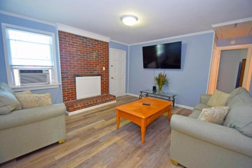 a living room with two couches and a coffee table at Holiday Cottage Cottage in Ocean City