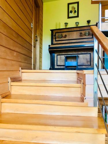 a set of stairs with a fireplace in a house at Casa Familiar con Vista al campo y al lago in Puerto Varas