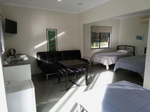Ένα ή περισσότερα κρεβάτια σε δωμάτιο στο Daintree Peaks ECO Stays