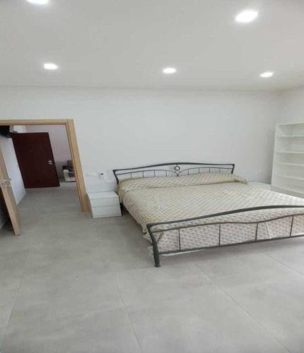 a bedroom with a bed and a mirror at Casa vacanze Via Treglia in Scauri