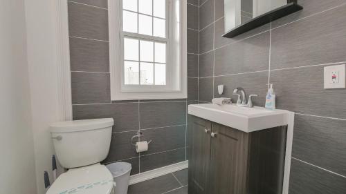 a bathroom with a toilet and a sink at Atlantic Suite by the Boardwalk 3B in Atlantic City