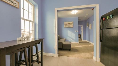 a kitchen with a black refrigerator and a living room at Atlantic Suite by the Boardwalk 2D in Atlantic City