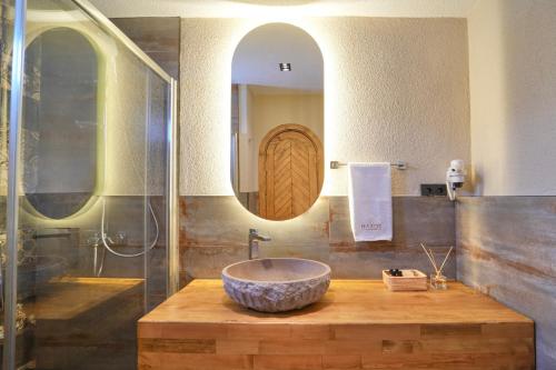 a bathroom with a sink and a mirror at Naxos Beach Hotel in Marmaris