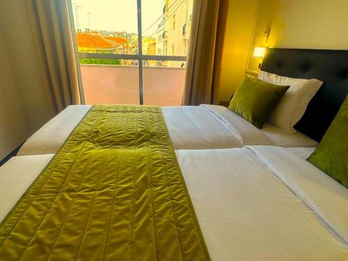 Katil atau katil-katil dalam bilik di Lisabonna Guest House