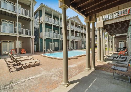 a swimming pool in the middle of a building at Cozy Beach House (4 min walk) w/Pool + Fast WiFi in Panama City Beach