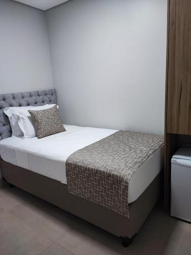 Ein Bett oder Betten in einem Zimmer der Unterkunft Hotel Conviver