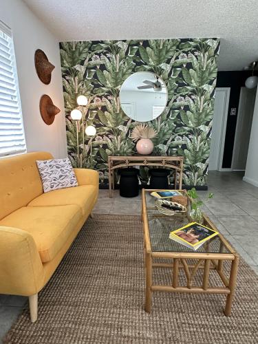 a living room with a couch and a table at Miami's Cozy Tropical Getaway in Miami