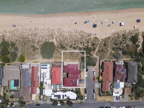 an aerial view of a beach with houses and condos at Sandy Shores Estate- Long Island in Frankston
