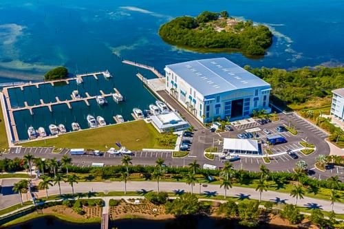 an aerial view of a large building with a marina at Five O'Clock Somewhere in Bradenton