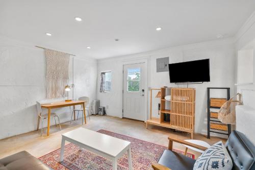 a living room with a couch and a tv at Studio 410 in Alpine