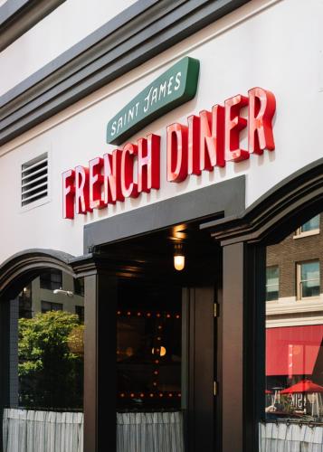 a french dinner sign on the front of a restaurant at Palihotel San Diego Gaslamp Quarter in San Diego