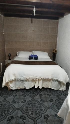 Tempat tidur dalam kamar di La Toscana