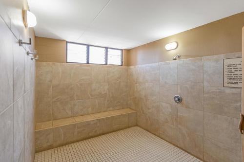 a bathroom with a shower with a tub at Beautiful Condo at Kihei Ali'i Kai, Close to Beach in Kihei