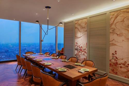 a conference room with a long table and chairs at Park Hyatt Jakarta in Jakarta