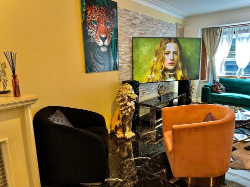 a living room with a table and two chairs at Luxury design apartment in Ostend