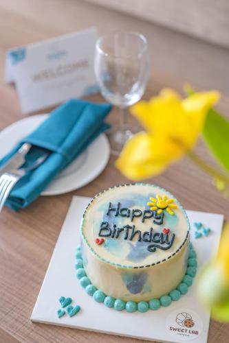 a birthday cake sitting on top of a table at Seaesta Nha Trang Hotel in Nha Trang