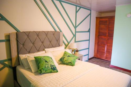 Ένα ή περισσότερα κρεβάτια σε δωμάτιο στο Escappé Suites