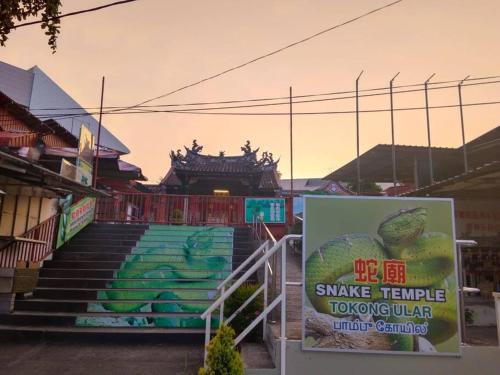 a set of stairs with a sign in front of a building at CEO7 Duplex Business Suite#Disneys HS#USM#Pisa#Pantai Hospital in Bayan Lepas
