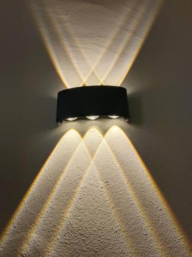 a light hanging from a wall with lights on it at CEO7 Duplex Business Suite#Disneys HS#USM#Pisa#Pantai Hospital in Bayan Lepas