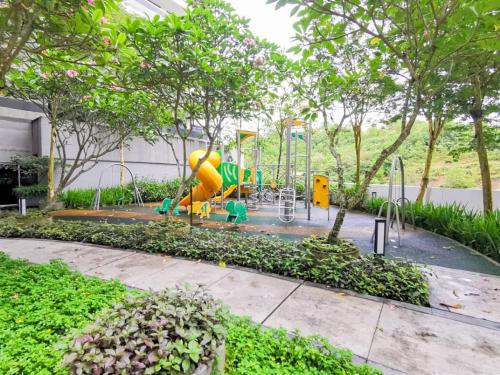 a playground with a slide in a park at Meridin Medini Suite by Nest Home【LEGOLAND】 in Nusajaya