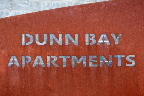 a sign that says dunham bayantments on it at Dunn Bay Apartment 5 I Private Properties in Dunsborough