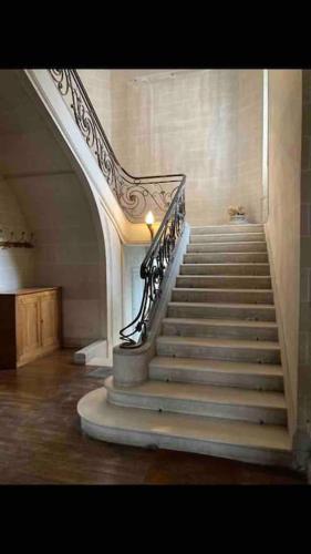 a staircase in a building with a stair case at Atypique Chevreul in Angers