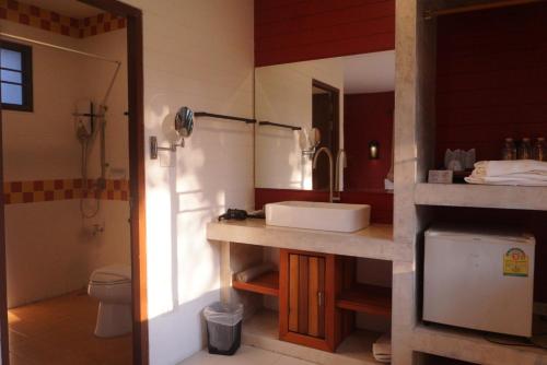 a bathroom with a sink and a toilet at ANANTAYA CHIANGMAI BOUTIQUE HOTEL in Chiang Mai