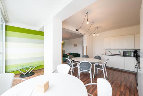 a kitchen and dining room with a table and chairs at Czech Family Home in Český Krumlov