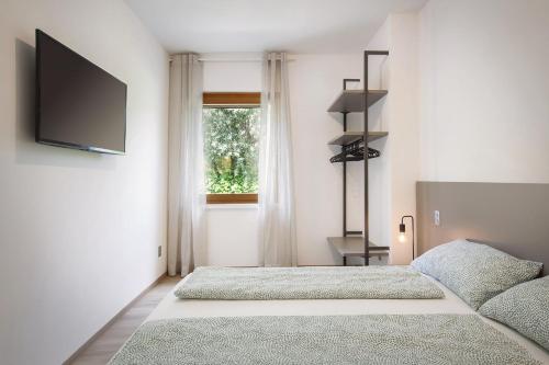 Letto o letti in una camera di Villa Fani-Wellness & Relax