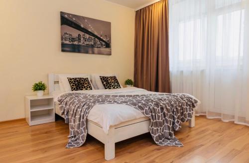 Кровать или кровати в номере Уютные апартаменты на Позняках
