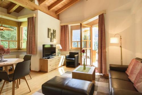 a living room with a couch and a table at Apparthaus Vonbank in Schruns-Tschagguns