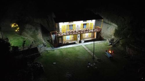 an aerial view of a house at night at Naughar Homestay in Almora