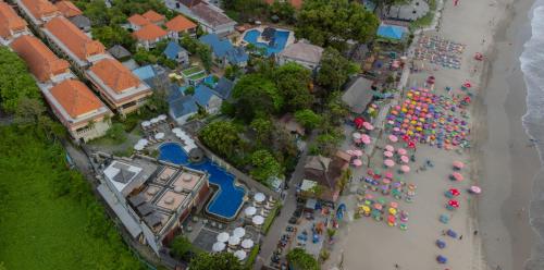 an overhead view of a beach with a bunch of umbrellas at Pelangi Bali Hotel & Spa in Seminyak