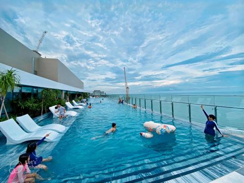a pool on a cruise ship with people in the water at The Sóng Apartments And Hotel 4 Stars in Vung Tau