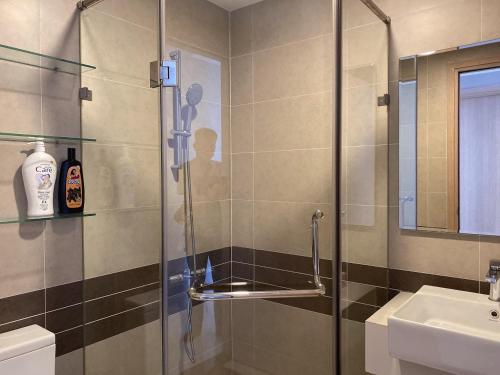 a bathroom with a shower and a sink at River gate Yourhomes 2br in Ho Chi Minh City