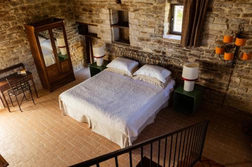 A bed or beds in a room at Casa Minotti Relais