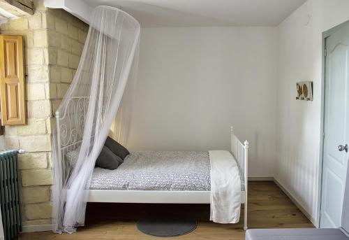 Säng eller sängar i ett rum på La Madriguera de Tomaso