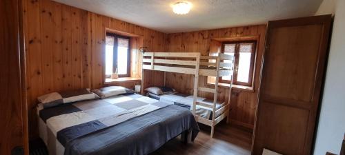 En eller flere senge i et værelse på La Maison de Vetan