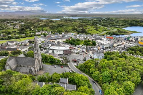 an aerial view of a town with a church and a city at Apartment 144 - Clifden in Clifden